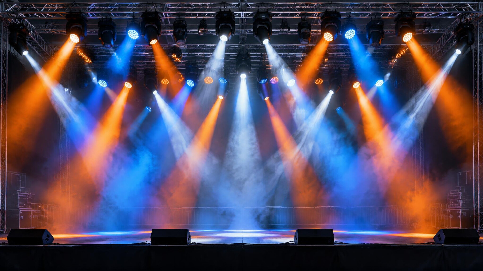 Concert stage lighting rig with colorful beams